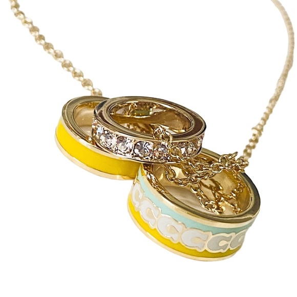 NEW Coach Buttercup Goldtone Enamel and Crystal Pendant on Card w/Dust Bag $168 - Picture 2 of 9